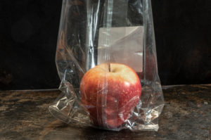 apple packed in non-biodegradable plastics apple packed in non-biodegradable plastics